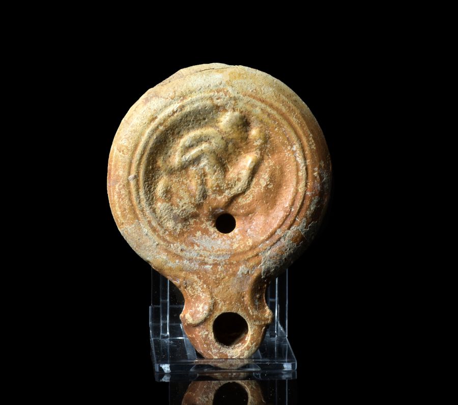 Roman terracotta oil lamp with erotic scene