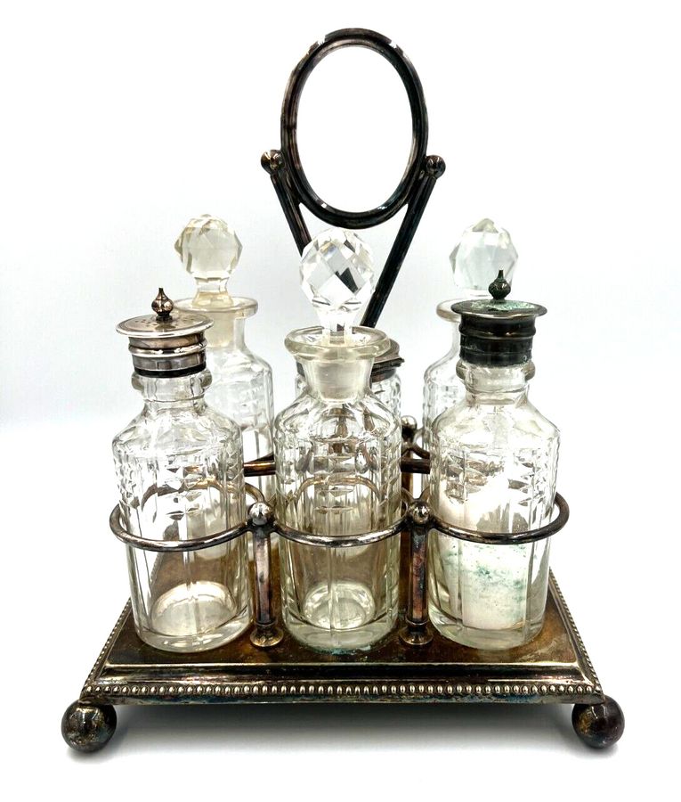 Antique Antique Silver Plated 6 Bottle Glass Condiment Set