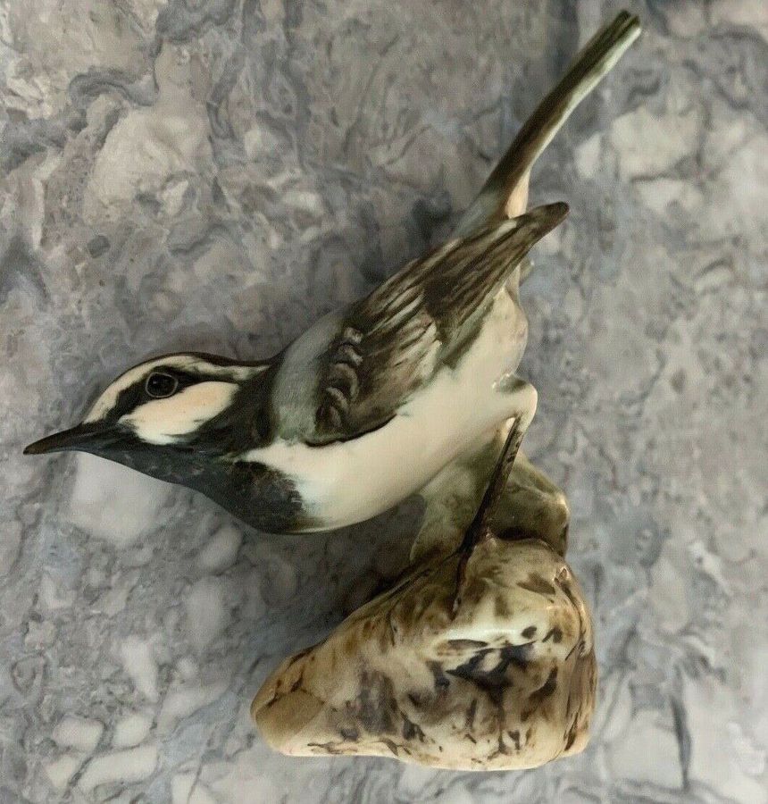 Antique A vintage West Germany kaiser porcelain bird figurine sit on a wooden plinth