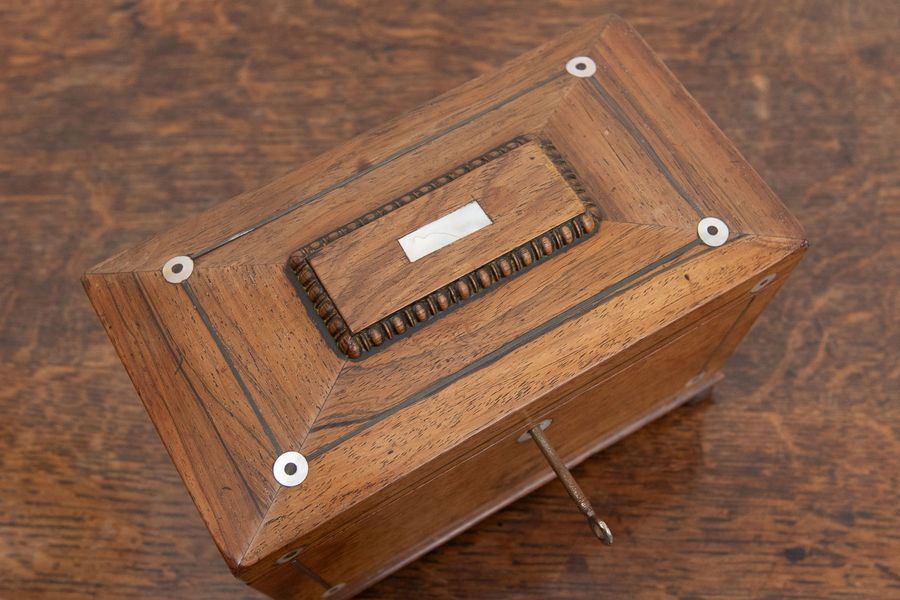 Antique Victorian rosewood and pewter tea caddy.