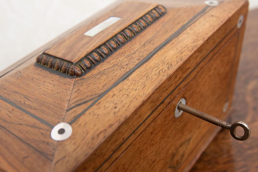 Antique Victorian rosewood and pewter tea caddy.