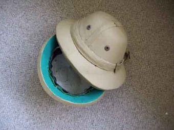 A selection of reproduction polo pith helmets for decorative use only