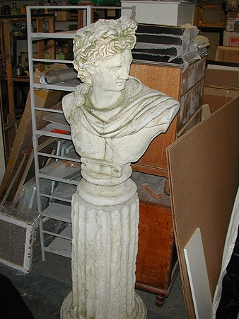A 20th century composition stone figure of Appollo circa 1960 on a plinth