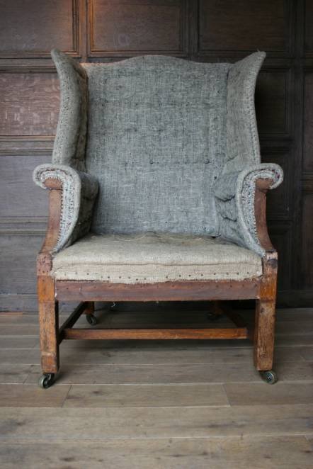 Antique An English wing armchair dated 1902