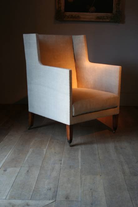 Antique An unusual early C19th English wing armchair