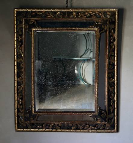 Antique A bold C19th gilt cushion mirror