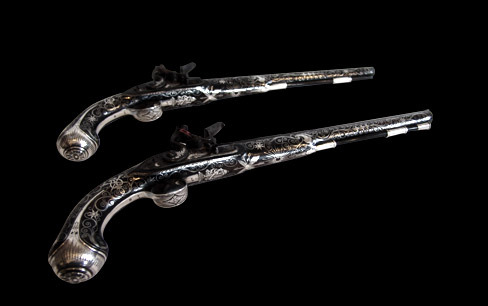 Exquisite Pair of Early 19th Century Silver Decorated Flintlock Pistols
